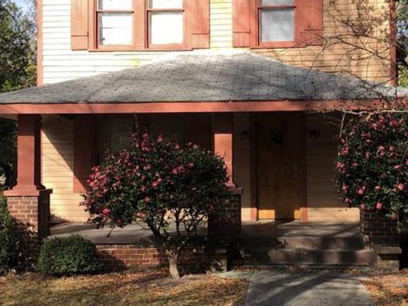 Front of house with Camillia bush