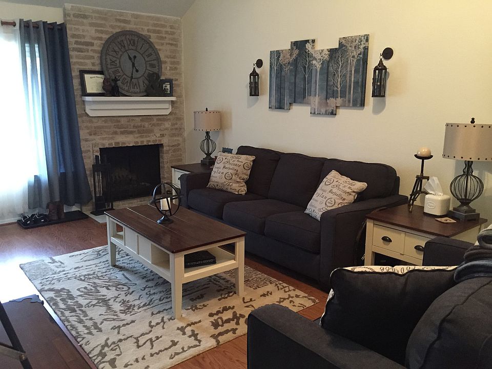 Living room with wood-burning fireplace