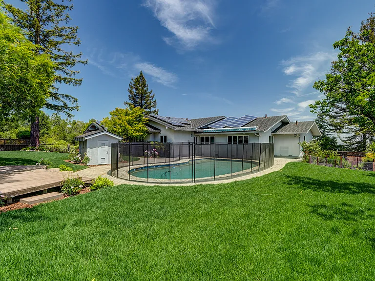 A sparkling pool at the front and a wonderfuldeck beckoning for entertainment or relaxation.