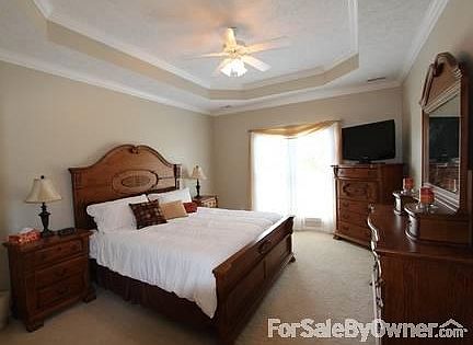 Master Bedroom
						:
						Spacious room with tray ceiling and built-in ironing board behind door.