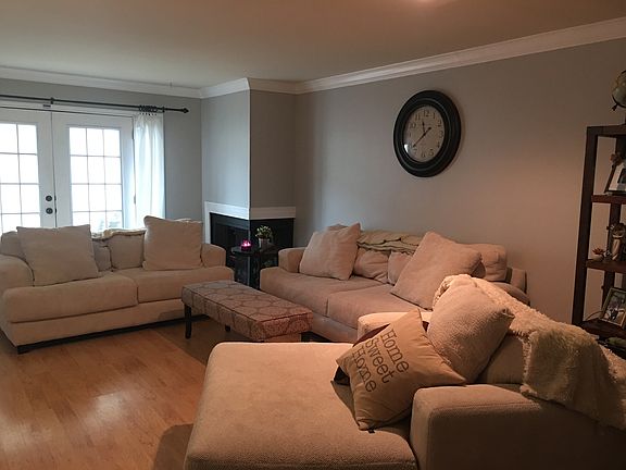 Wood fireplace in living room.