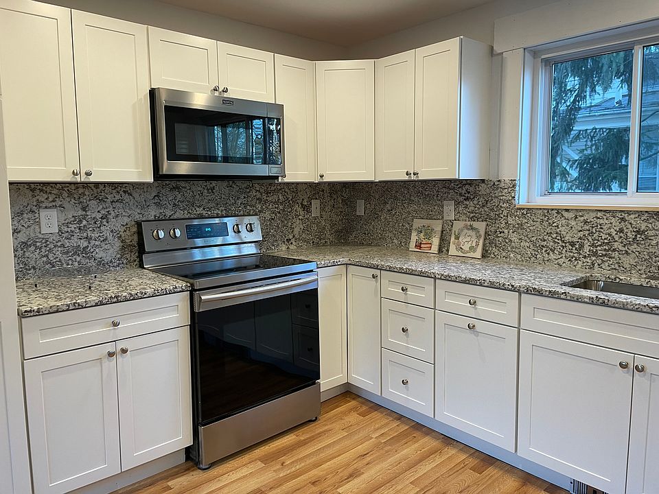 Brand new kitchen - new cabinets, granite countertops, newer appliances.