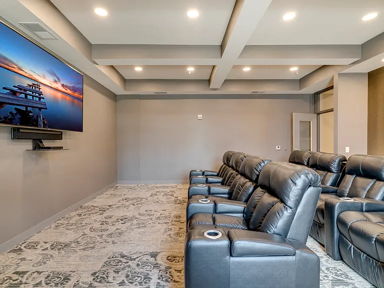 Sink into our leather chairs for a movie in the theater room.