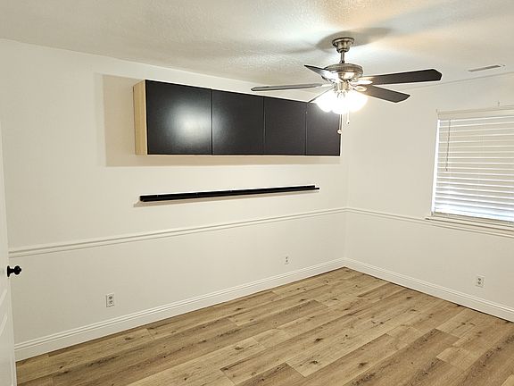 Main Bedroom from entrance doorway, bathroom door open on left