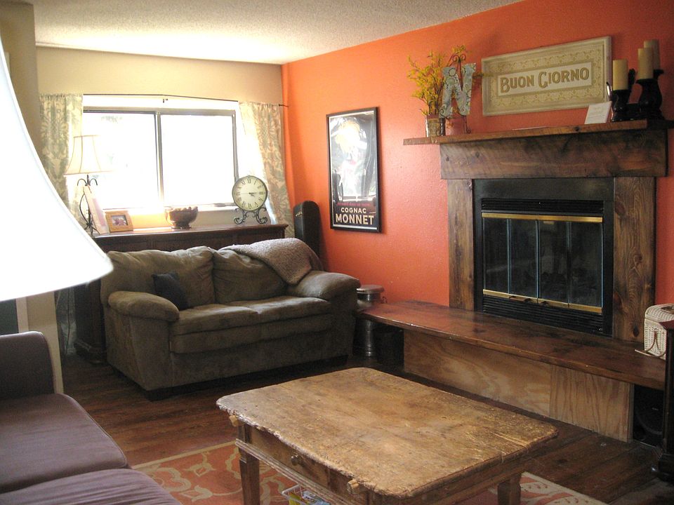 living room with custom beetle kill pine fireplace.