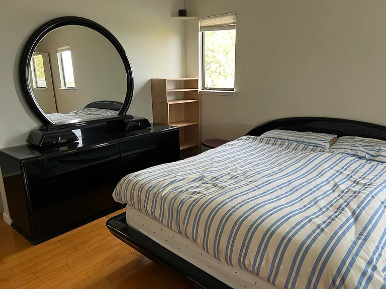 Italian made bed and 6-drawer dresser with mirror in primary suite