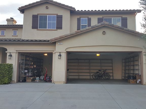 3 car garage with shelves