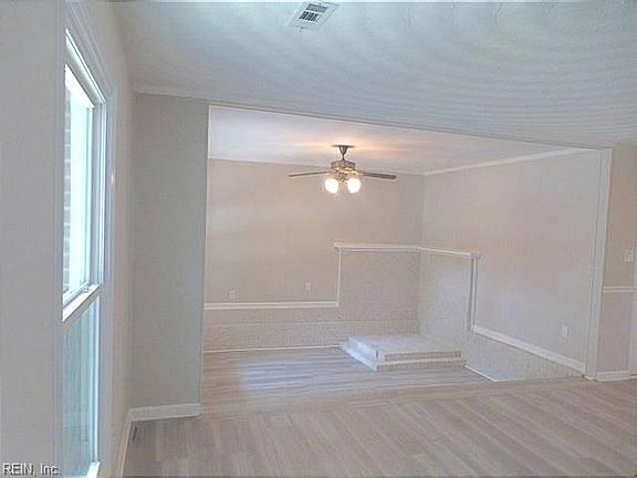 SUNKEN DEN RIGHT OFF THE LIVING ROOM WITH A BUILT UP AREA WITH A WOODEN! GREAT FOR YOUR TELEVISION AND OR KNICK-KNACKS & FAMILY PICTURES!