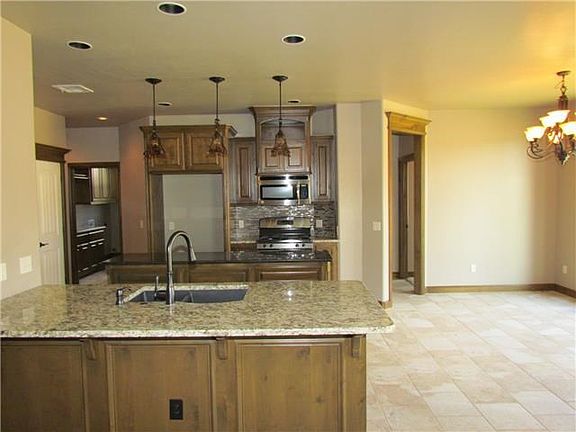 Kitchen. SPACIOUS KITCHEN WITH LARGE PREP ISLAND AND STAINLESS STEEL APPLIANCES