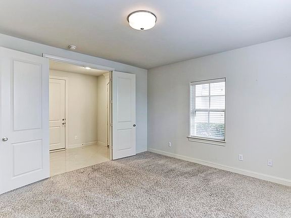 1st floor bedroom with on suite bath and access to outside space.