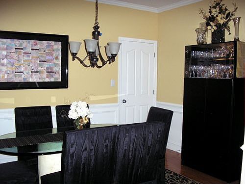 Dining Room has 2 windows w plantation shutters, hardwoods.