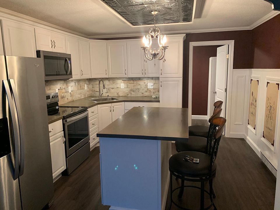 Large, newly remodeled kitchen with sit in bar, stainless steel appliances.