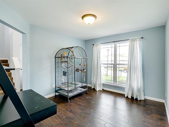 This room has several uses.  Office, formal dining room, or a study.  Currently used as an office and home for the family pet bird.