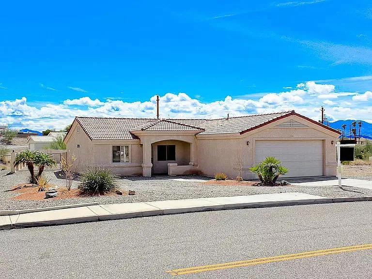 Front view of house, large corner lot.