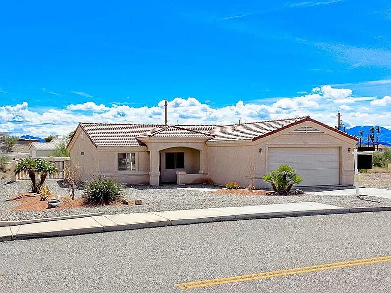 Front view of house, large corner lot.