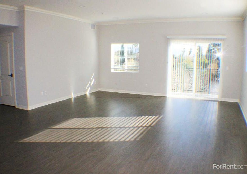 Open plan Living Room with HUGE East-facing balcony.