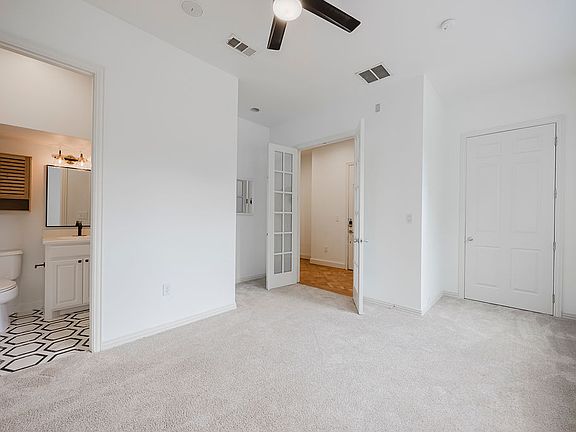 1st floor bedroom w/ walk-in closet and ensuite bathroom w/ shower