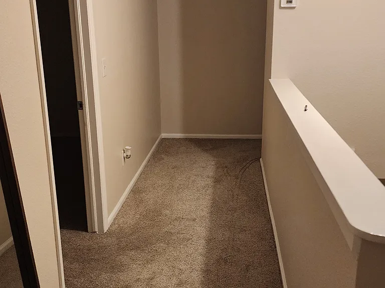 upstairs hallway with access to the three bedrooms