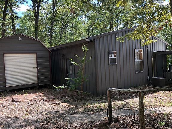 Second home with large open floor plan approx. 1223 Sq. Ft with full kitchen, full bathroom and closet. Refrigerator goes with the second home. Metal building for all your storage needs.