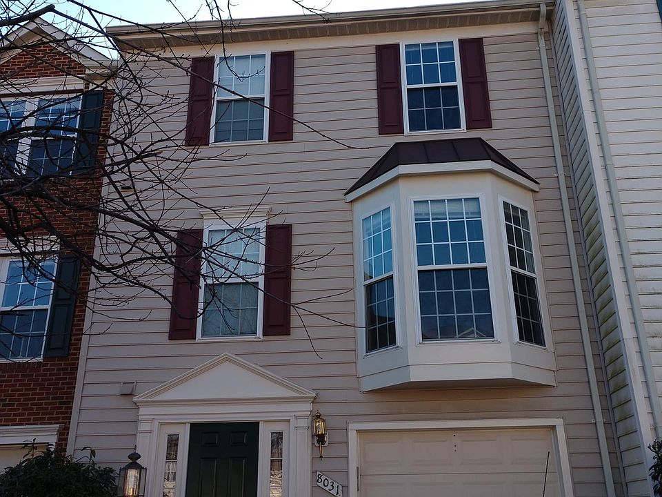 1. Front of the House. One car garage with driveway.