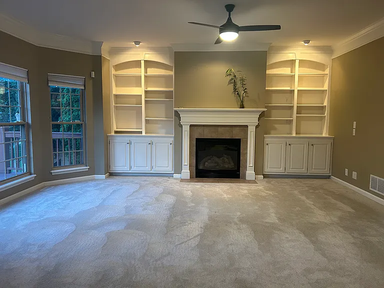 Built ins bookshelves and cabinets. Pre-wired for a monitor above the fireplace.