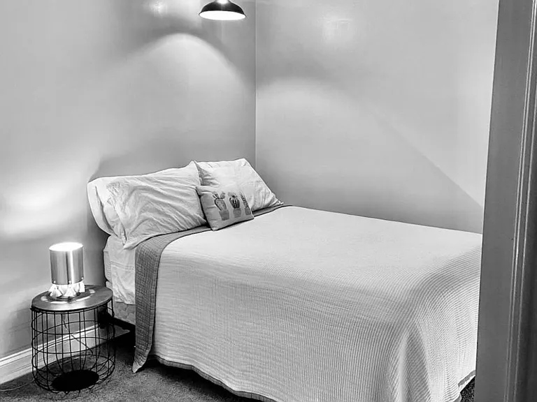 Queen size bed and dark bedroom. Perfect for a good nights sleep