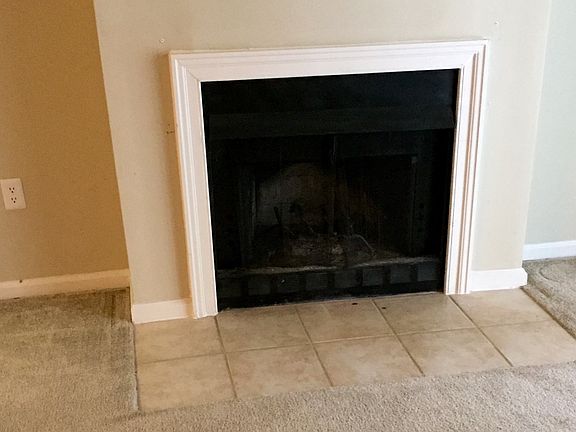 Wood burning fireplace in living room