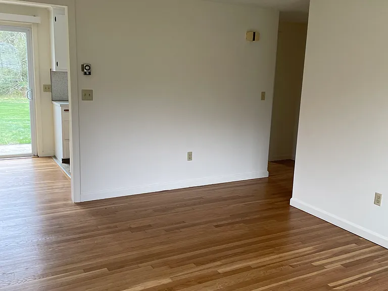 View from front door into living area and part of dining area