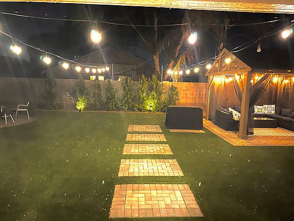 Nice large backyard with lighting and big gazebo. Perfect to watch movies outside at nights.