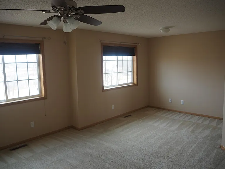 Extra large master bedroom with room for a desk or exercise equipment.