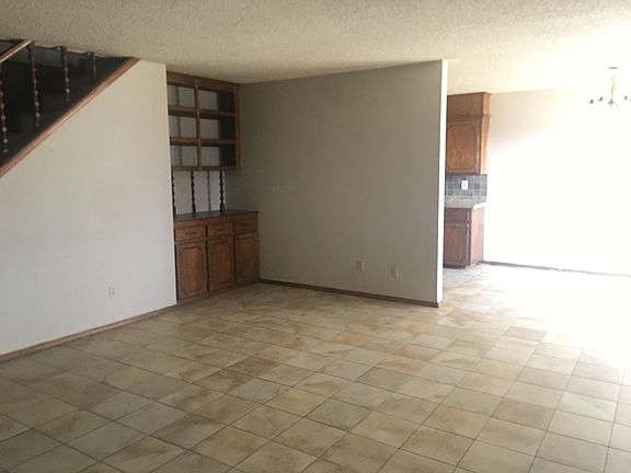 Built in cabinets and shelves in living area.