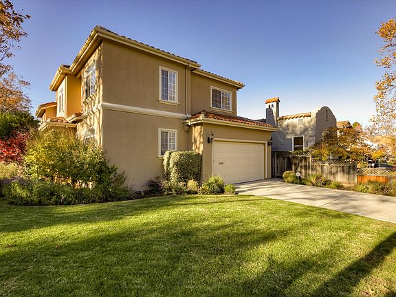 attached two car garage with ample driveway parking as well
