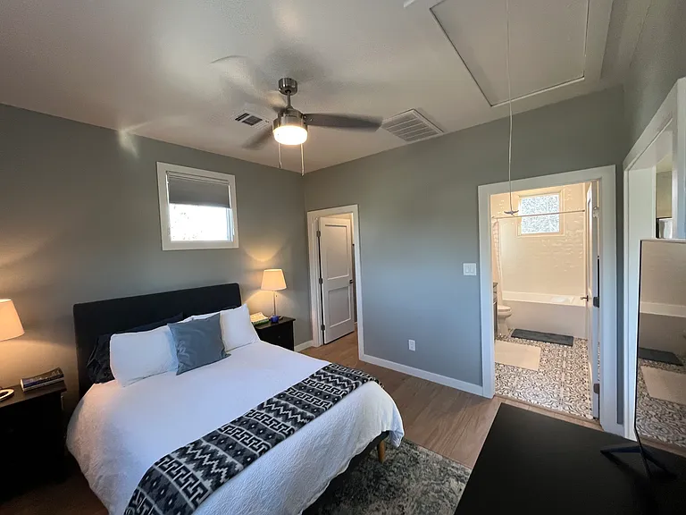 bedroom with full bath and walk in closet