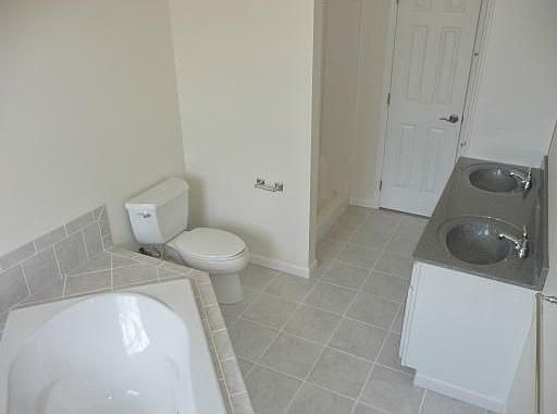 Luxury Bath in Master Suite has a jet spray tub.