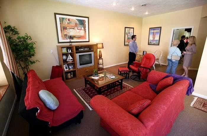 A great room with vaulted ceilings gives the feeling of more