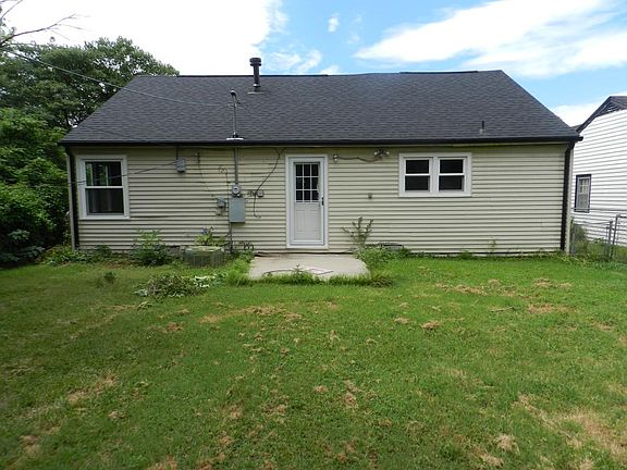Rear view with large fenced yard
