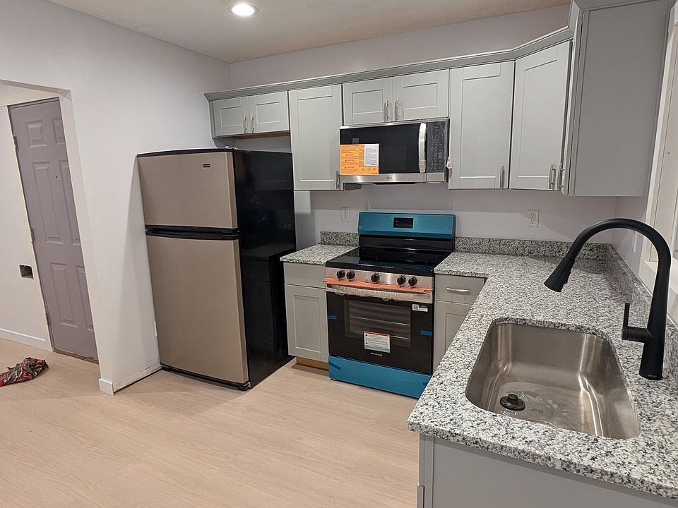Fully renovated kitchen with brand new appliances and flooring.