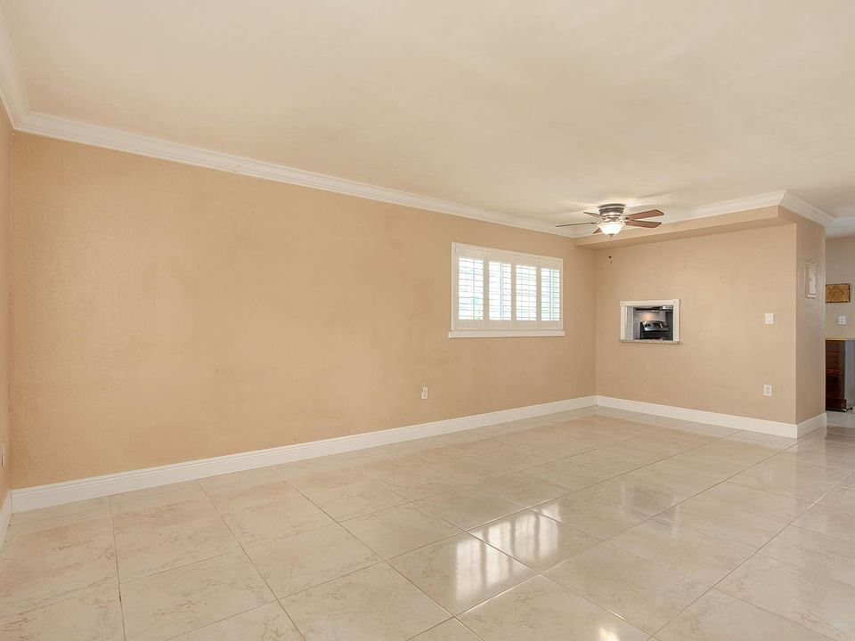 Living Room (Downstairs): Connected to the updated chef's kitchen - great for entertaining and guests.