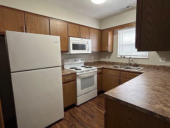 Kitchen has refrigerator, stove, microwave, garbage disposal and dishwasher.