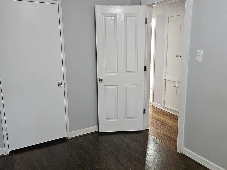 Bedroom 1. Built-in linen closet in hallway.