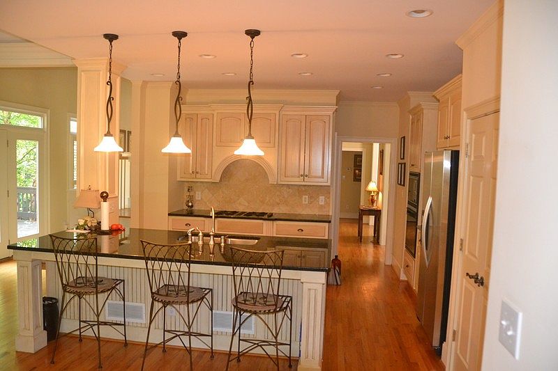 Kitchen
						:
						Custom cabinetry, granite