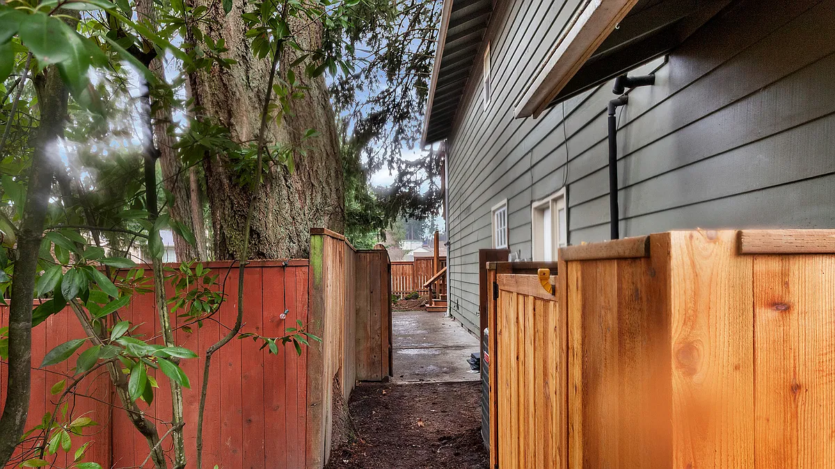 Rear entrance around gated side - SW Springdale Ct