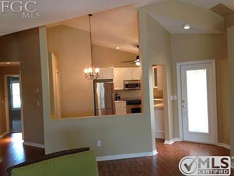 VIEW of front door with kitchen to side as you come in