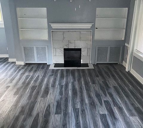 Living room with electric fireplace.