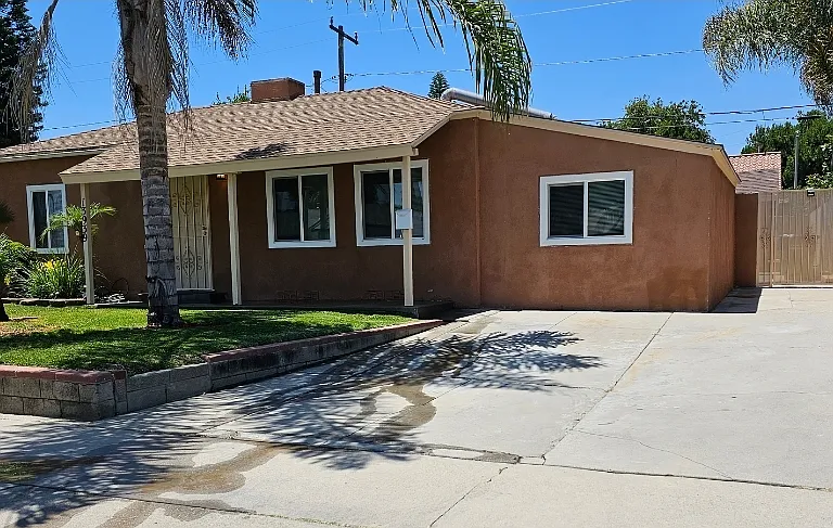 The studio for rent is behind this main house.