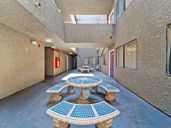 Resident courtyard with outdoor seating and natural light throughout the community.