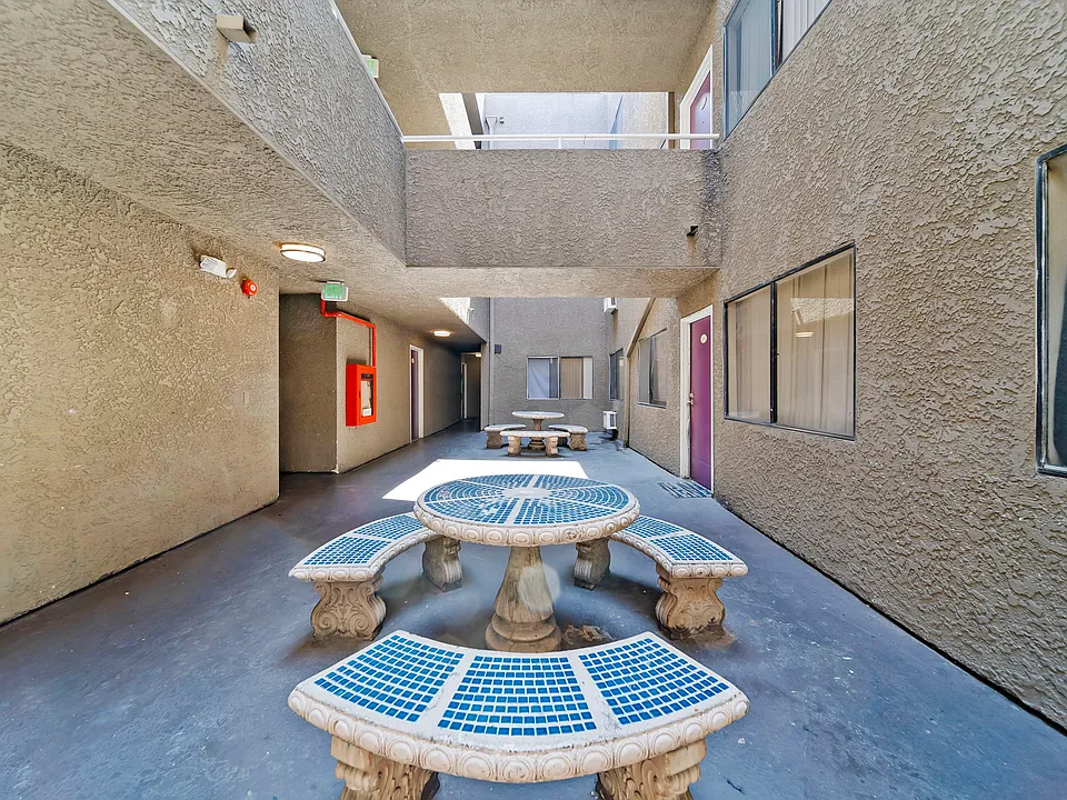 Resident courtyard with outdoor seating and natural light throughout the community.