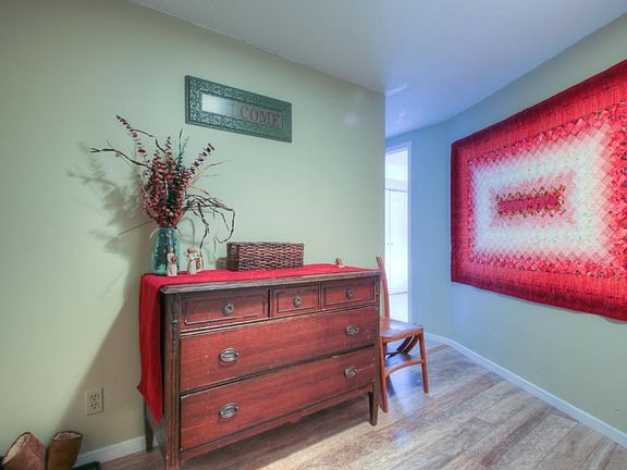 Welcoming foyer with modern paint colors and flooring.