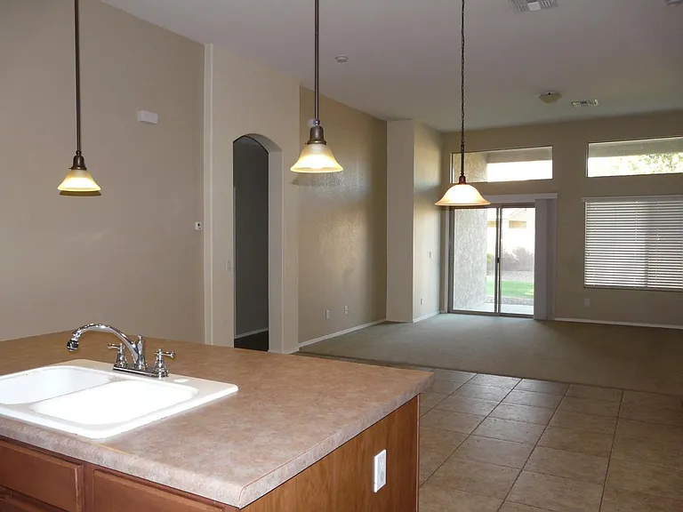 the kitchen island and Family room /entry to backyard patio