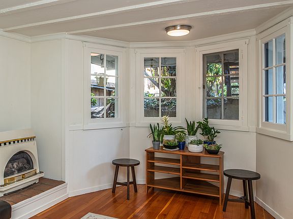 Front room that doubles as a small kitchenette and small living space.